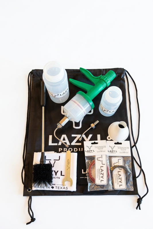 Goat Game Time Drench Kit with green drench gun, bottles, goat nozzles, funnel, and accessories on a Lazy L bag against a white background